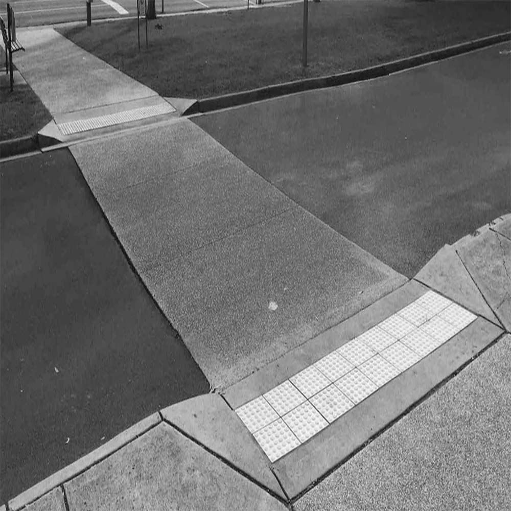 Why You Still Need TGSIs on a Kerb Ramp—Even If It Meets AS1428.4.1